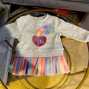 Sweater with a tutu bottom.